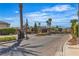 A gated entry welcomes residents to the Stetson Ranch community, featuring lush landscaping and a secure entrance at 6148 Whitelion Walk St, Las Vegas, NV 89148