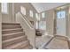 Entryway with high ceilings, decorative accents, and easy access to the second story via the staircase at 6148 Whitelion Walk St, Las Vegas, NV 89148