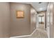 Hallway view showcasing neutral decor and carpet flooring with doorways to other rooms at 6148 Whitelion Walk St, Las Vegas, NV 89148