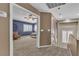Hallway featuring a glimpse into a bedroom and a staircase leading to another level at 6148 Whitelion Walk St, Las Vegas, NV 89148