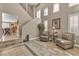 Inviting living room features neutral tones, high ceilings, and elegant decor at 6148 Whitelion Walk St, Las Vegas, NV 89148