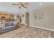 Bright living room featuring tile floors, neutral paint and cozy seating at 6148 Whitelion Walk St, Las Vegas, NV 89148