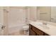 Bright bathroom featuring a shower and bathtub combination, toilet, sink and mirror at 677 Viale Machiavelli Ln, Henderson, NV 89011