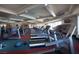 Well-equipped fitness center with treadmills and weight machines for a comprehensive workout at 677 Viale Machiavelli Ln, Henderson, NV 89011