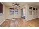Bright living space with wood flooring, sliding glass door, and abundant sunlight at 677 Viale Machiavelli Ln, Henderson, NV 89011