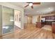 Open-concept area featuring stainless appliances, tile and wood floors and view to covered patio at 677 Viale Machiavelli Ln, Henderson, NV 89011