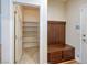 Mud room with a storage bench and a pantry behind a door at 677 Viale Machiavelli Ln, Henderson, NV 89011