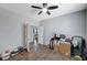 Bedroom with ceiling fan, hardwood flooring, and natural lighting at 6773 Bristle Falls St, Las Vegas, NV 89149