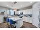Bright kitchen with white cabinets, stainless steel appliances, and a large center island at 6773 Bristle Falls St, Las Vegas, NV 89149