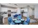 Bright kitchen with white cabinets, stainless steel appliances, and eat-in island at 6773 Bristle Falls St, Las Vegas, NV 89149