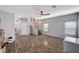Open living area with wood floors, staircase, and mini-split A/C unit at 6773 Bristle Falls St, Las Vegas, NV 89149