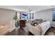 Bright and airy living room with hardwood floors, comfortable seating, and large screen television at 6773 Bristle Falls St, Las Vegas, NV 89149