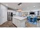 Open floorplan showcasing the kitchen and living room with hardwood floors at 6773 Bristle Falls St, Las Vegas, NV 89149