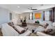 Open-concept living room boasting hardwood floors, modern décor, and a cozy seating area at 6773 Bristle Falls St, Las Vegas, NV 89149