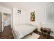 Comfortable bedroom featuring white walls, wood floors, large closet and natural lighting at 7633 Alexander Hills St, Las Vegas, NV 89139