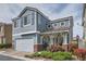 Charming two-story home with blue siding, brick accents, and a well-maintained front yard at 7633 Alexander Hills St, Las Vegas, NV 89139
