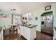 Bright kitchen features an island, stainless steel appliances, and an adjacent dining area at 7633 Alexander Hills St, Las Vegas, NV 89139