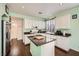 Modern kitchen featuring granite countertops, white cabinets, and stainless steel appliances at 7633 Alexander Hills St, Las Vegas, NV 89139