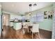 Open kitchen and dining area features an island, and plenty of natural light at 7633 Alexander Hills St, Las Vegas, NV 89139