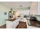 Well-equipped kitchen with granite countertops, stainless steel appliances, and white cabinetry at 7633 Alexander Hills St, Las Vegas, NV 89139