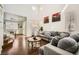 Bright living room with high ceilings, wood floors, and contemporary furnishings at 7633 Alexander Hills St, Las Vegas, NV 89139