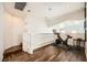 Upstairs loft space featuring dark wood floors and exercise equipment at 7633 Alexander Hills St, Las Vegas, NV 89139