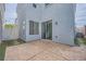 Spacious backyard patio with sliding door access to home, adjacent to small grassy area at 7633 Alexander Hills St, Las Vegas, NV 89139
