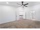 Large bedroom with carpet and access to bathroom and upper level at 80 Sea Holly Way, Henderson, NV 89074