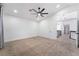 Spacious carpeted bedroom with ceiling fan and access to upper level at 80 Sea Holly Way, Henderson, NV 89074