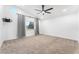 Bright bedroom with carpet, ceiling fan, and curtains at 80 Sea Holly Way, Henderson, NV 89074