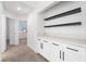 Hallway features built-in cabinets with shelving, providing ample storage and style at 80 Sea Holly Way, Henderson, NV 89074