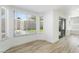 Bright living room features luxury vinyl floors and multiple windows at 80 Sea Holly Way, Henderson, NV 89074