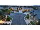 An aerial view shows the neighborhood with lush landscaping, street lights, and well maintained sidewalks at 8369 Eagle Estates Ct, Las Vegas, NV 89131