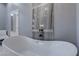 This luxurious bathroom showcases a standalone tub with decorative tile, perfect for relaxing after a long day at 8369 Eagle Estates Ct, Las Vegas, NV 89131