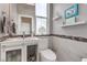 Modern bathroom featuring a stylish vanity, white marble tile and decorative accents, offering a clean and contemporary feel at 8369 Eagle Estates Ct, Las Vegas, NV 89131