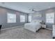 Bright bedroom with modern decor, a cozy carpet, and multiple windows, creating a relaxing and inviting space at 8369 Eagle Estates Ct, Las Vegas, NV 89131