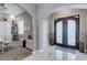 Inviting entryway featuring a decorative double door, marble floors and views into the office area at 8369 Eagle Estates Ct, Las Vegas, NV 89131
