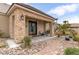 Charming home with stone accents, a decorative front door, and meticulously landscaped front yard at 8369 Eagle Estates Ct, Las Vegas, NV 89131