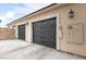 Close-up of the decorative garage doors with automated security and adjacent utility access at 8369 Eagle Estates Ct, Las Vegas, NV 89131