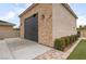Detached garage with stone and stucco facade and tidy landscaping at 8369 Eagle Estates Ct, Las Vegas, NV 89131