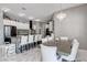 Eat-in kitchen featuring stone counter tops, stainless appliances, and modern lighting at 8369 Eagle Estates Ct, Las Vegas, NV 89131