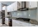 Modern kitchen with stainless appliances and subway tile backsplash at 8369 Eagle Estates Ct, Las Vegas, NV 89131