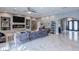 Spacious living area with a fireplace, large TV, and marble floors at 8369 Eagle Estates Ct, Las Vegas, NV 89131