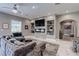 Open living space with modern electric fireplace, stylish shelving, and comfortable seating area at 8369 Eagle Estates Ct, Las Vegas, NV 89131