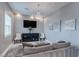 Modern living room showcasing a large TV, elegant chandelier, and comfortable seating at 8369 Eagle Estates Ct, Las Vegas, NV 89131