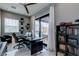 Bright home office with sleek desk, pool view, and built-in shelving at 8369 Eagle Estates Ct, Las Vegas, NV 89131