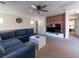 Open living room with exposed brick wall and comfortable seating at 9105 Captivating Ave, Las Vegas, NV 89149