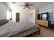 Serene main bedroom with ceiling fan and ensuite bathroom access at 9105 Captivating Ave, Las Vegas, NV 89149