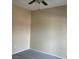 Clean bedroom with plush carpeting, neutral walls, and a ceiling fan at 9303 Gilcrease Ave # 2164, Las Vegas, NV 89149
