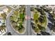 Aerial view of an urban park with lush green ponds and tree cover, situated on a well maintained street at 9625 Beach Water Cir, Las Vegas, NV 89117